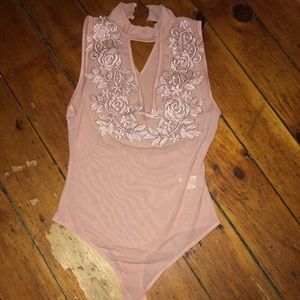 Pink see-through body suit